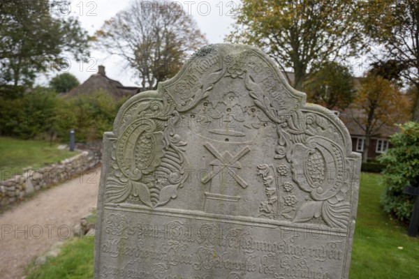 Close-up of a baroque gravestone in the cemetery of St John's Church, Nieblum, Föhr Island, Schleswig-Holstein, Germany
