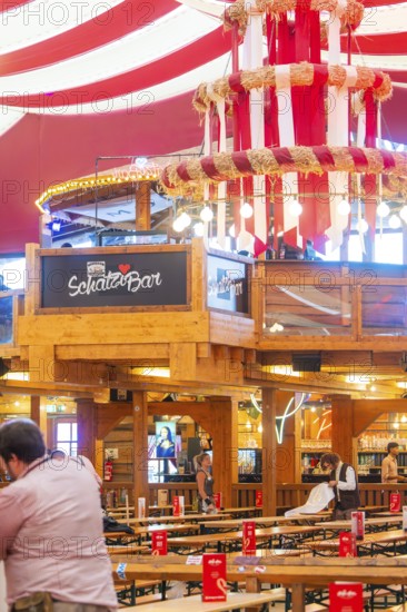 Bar area in a festively decorated beer tent with red ceilings and wooden elements, Volksfest Cannstatter Wasen, Sonja Merz Festzelt, Stuttgart, Germany