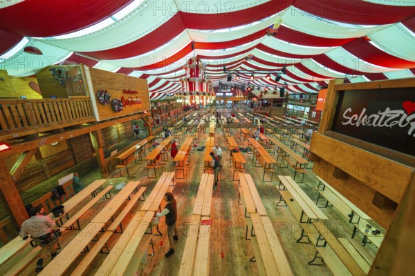 Large marquee with red ceilings and wooden benches, Bavarian atmosphere and decoration, Volksfest Cannstatter Wasen, Sonja Merz Festzelt, Stuttgart, Germany