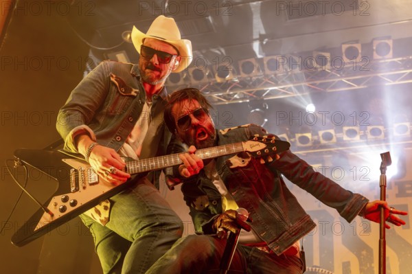 Stefan Bühler (Russ T. Rocket), guitarist, and Alec Völkel (Boss Burns), singer of the band The BossHoss on their Back To The Boots Tour 2025 at Capitol Hannover on 3 October 2025