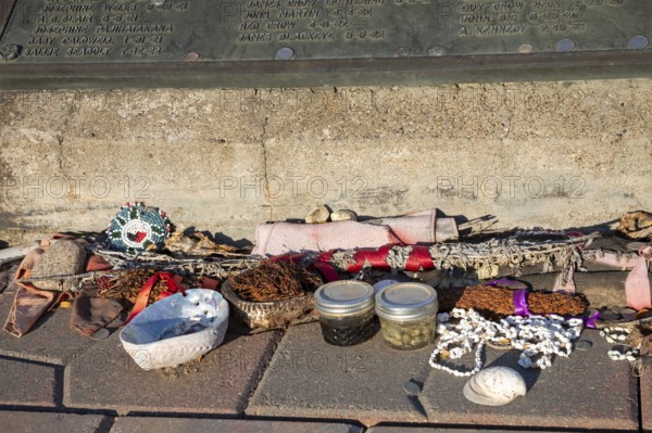 Canton, South Dakota - Remembrances left at a marker listing the names of 120 patients at the Canton Asylum for Insane Indians who are buried in unmarked graves. Not all inmates of the federal facility, which closed in 1934, were insane. The cemetery is now surrounded by the Hiawatha Golf Course
