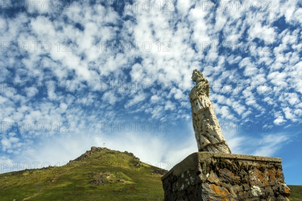 Statue of Virgin Mary. Roc de Courlande in Auvergne Volcanoes Regional Park. Puy de Dome. Auvergne Rhone Alpes. France