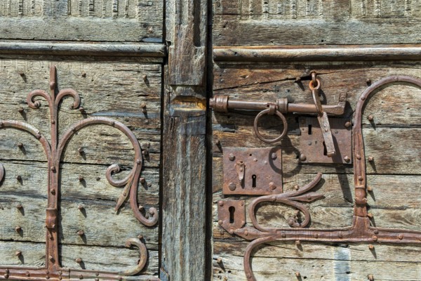 Ancient lock and mechanism of the Romanesque church of Mailhat in Puy de Dome, Auvergne Rhone Alpes, France