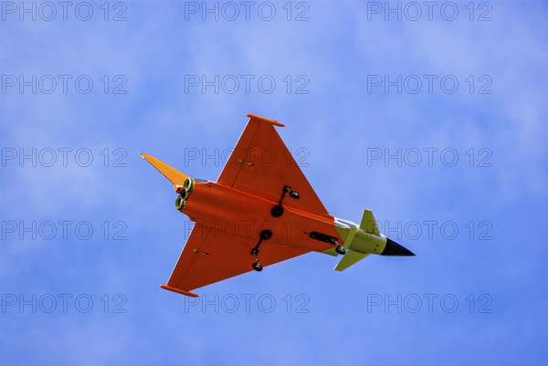 An RC model of a Eurofighter Typhoon during a flight demonstration as part of an air show at the Rossfeld in Metzingen-Glems, Baden-Württemberg, Germany, for editorial use only