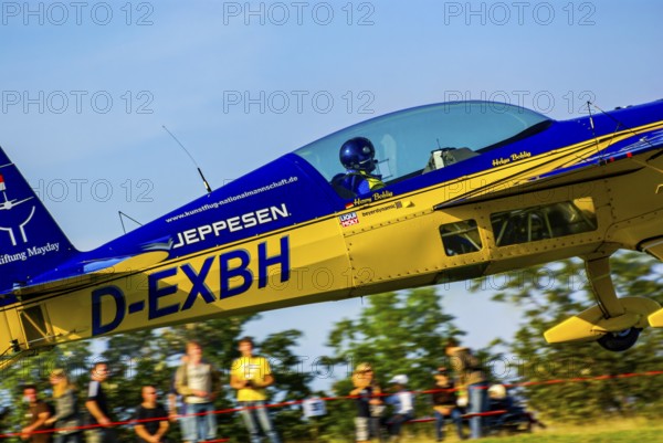 An Extra EA-300 of Extra Flugzeugproduktions- und Vertriebs GmbH with the registration D-EXBH during a flight demonstration as part of an air show at the Rossfeld in Metzingen-Glems, Baden-Württemberg, Germany, for editorial use only