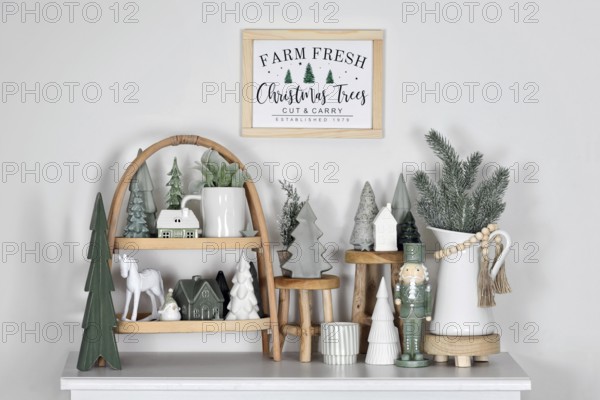 Farmhouse or boho style Christmas home decoration in trendy white and mint green colors