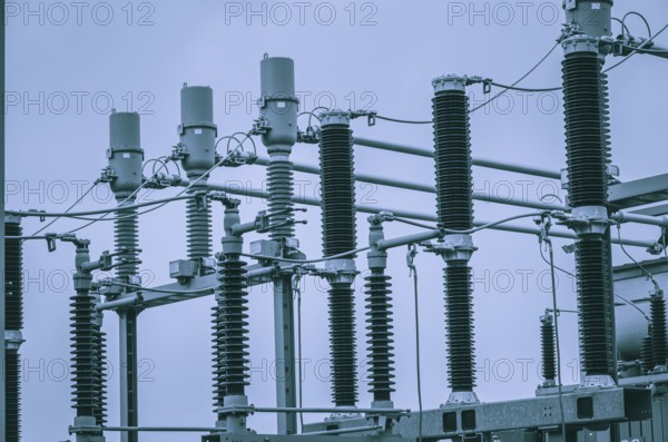 Concept of electricity and power generation using the example of insulators and devices in a substation