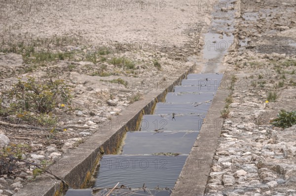 Fish ladder at a waterless body of water, an emptied reservoir, the Metzingen-Glems reservoir, Baden-Württemberg, Germany