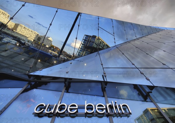Cube Berlin, cube-shaped office building with inwardly folded glass façade reflecting the surroundings, Washingtonplatz, Berlin, Germany