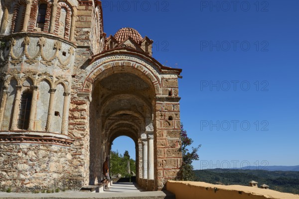 Pantanassa Monastery from the 15th century AD, An ancient archaic passageway in Greece against a clear blue sky, Mystras, Mistra, UNESCO World Heritage Site, Medieval Byzantine ruined city, northwest of Sparta, Taygetos promontory, Peloponnese, peninsula, Greece