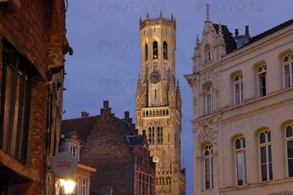 Illuminated Belfry in the historic city centre of Bruges in the evening light, Belfort on the Grote Markt, market square, UNESCO World Heritage Site, Bruges, Flanders, Belgium