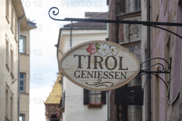 Nostalgic inn sign with the inscription Tyrol genießen, Innsbruck, Tyrol, Austria