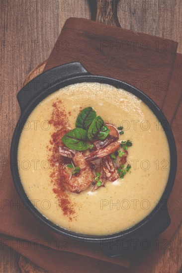 Pumpkin cream soup with shrimp, herbs and spices, homemade, no people