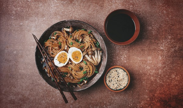 Buckwheat noodles, soba, with shimeji mushrooms, boiled egg, green onion, sesame seeds, homemade, no people