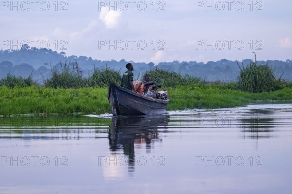 Boat with tourists in Mabamba Swamp, tourists photographing birds, Mabamba Swamp, Lake Victoria, Uganda