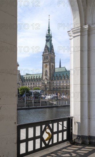 View of Hamburg City Hall through an arcade of the Alster Arcades, Jungfernstieg, Hamburg, Germany