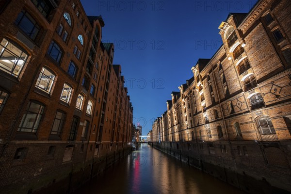 Illuminated warehouses in Hamburg's Speicherstadt, blue hour, Hamburg, Germany