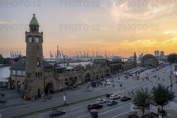 St. Pauli Landungsbrücken with the tide gauge tower and the Elbe, Hamburg harbour in the background, at sunset, Hamburg, Germany