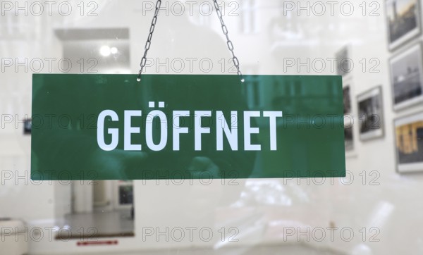 Open sign in the window of an art gallery, Berlin, 05.10.2025, Berlin, Berlin, Germany