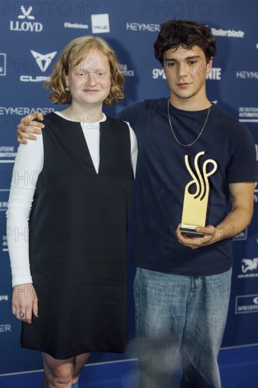 Carlo Krammling (here next to Luise von Stein) receives the award in the Best Newcomer category for No Dogs Allowed at the German Acting Award ceremony at Pullmann Berlin Schweizerhof, Berlin, 09.10.2025