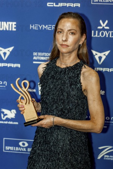 Katharina Schüttler accepts the German Acting Award 2025 for the category Strong Performance in The Cum-Ex Affair on behalf of Lina Beckmann at the award ceremony of the Pullmann Berlin Schweizerhof, Berlin, 09.10.2025