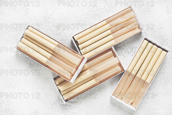 Cigarette casings, packed in boxes, on the table, top view