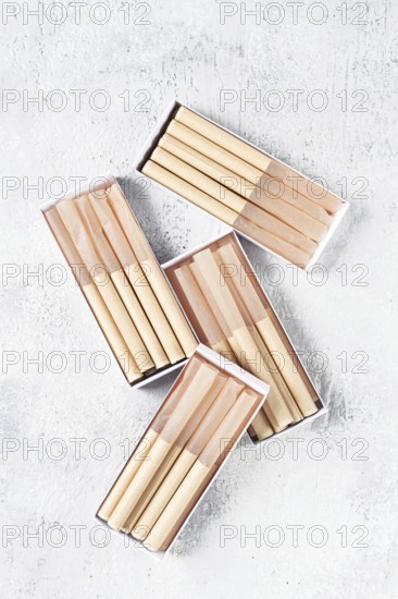 Cigarette casings, packed in boxes, on the table, top view