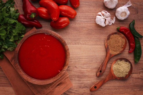 Georgian sauce, Satsebeli sauce, tomato and sweet pepper sauce, with spices, in a wooden bowl, homemade, no people