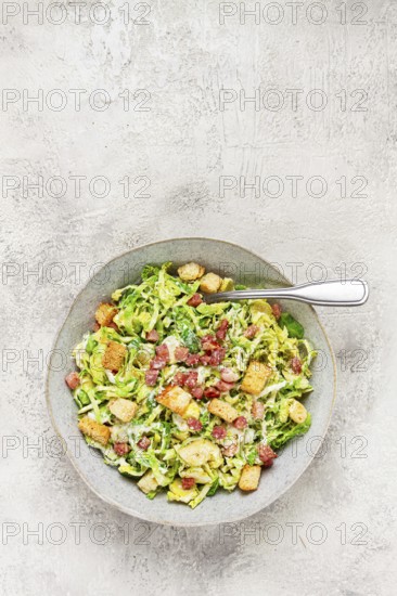 Brussels sprouts Caesar salad, with bacon and croutons, healthy food, homemade, no people