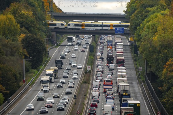 Local train crossing the A3 motorway between the Hilden junction and the Mettmann junction, view to the south, traffic jam due to construction work, North Rhine-Westphalia, Germany