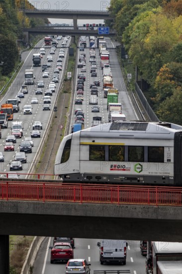 S-Bahn S28 crosses the A3 motorway between the Hilden junction and the Mettmann junction, view to the south, traffic jam due to construction work, North Rhine-Westphalia, Germany