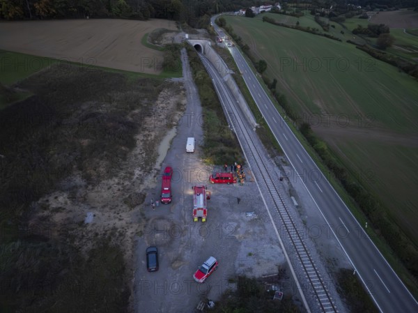 Aerial view of an operation site on railway tracks and roads with fire engines, fire drill in the new tunnel of the Hermann Hesse railway, Ostelsheim, district of Calw, Germany