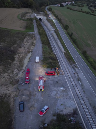 Aerial view of an operation site on a road and railway tracks, rural landscape, fire drill in the new tunnel of the Hermann Hesse railway, Ostelsheim, district of Calw, Germany