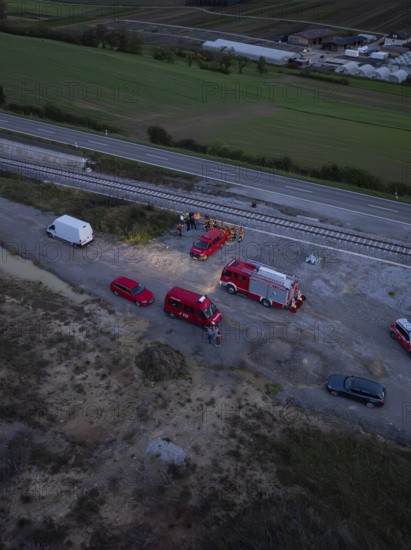 Aerial view of an operation site on railway tracks, several fire engines can be seen, fire drill in the new construction tunnel of the Hermann Hessebahn, Ostelsheim, district of Calw, Germany