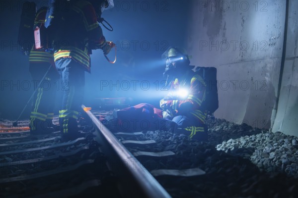 Emergency services on the ground in the tunnel at night, fire brigade exercise in the new tunnel of the Hermann Hesse railway, Ostelsheim, Calw district, Germany