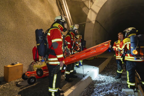 Firefighters prepare rescue in the tunnel with stretcher, firefighting exercise in the new tunnel of the Hermann Hesse railway, Ostelsheim, district of Calw, Germany