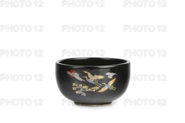 Black bowl with golden cranes, Asian decor, white background