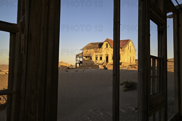 View from a former dwelling house into the desert, Kolmanskop, restricted diamond area, Karas region, Namibia
