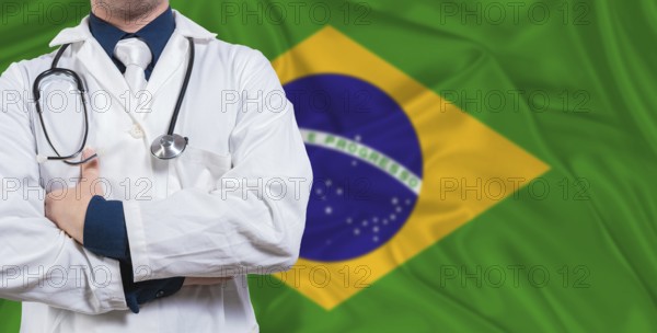 Male doctor with stethoscope on Brazil flag. Doctor holding stethoscope on Brazil flag