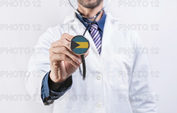 Bahamas healthcare system, doctor holding stethoscope. Bahamas health and medical insurance concept