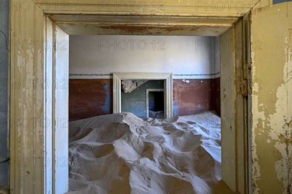 Sand mountains in a former dwelling house, interior photograph, Kolmanskop, restricted diamond area, near Lüderitz, Karas region, Namibia