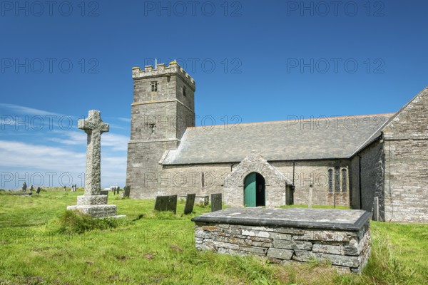 The Norman church of St Materiana with graveyard and stone cross, Tintagel, Cornwall, England, Great Britain