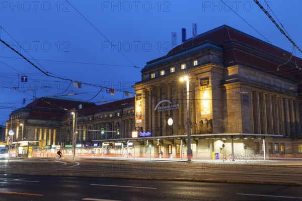 Street and tram tracks in front of the main station, tracers, blue hour, main station, Leipzig, Saxony, Germany