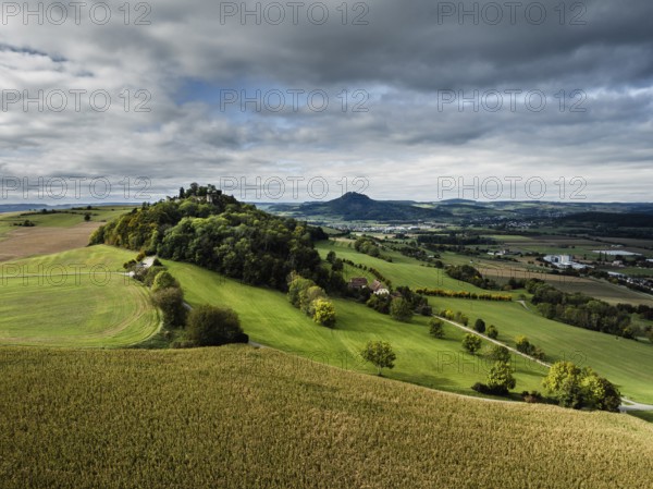 Aerial view of the Hegau volcano and the Mägdeberg castle ruins, Hohenhewen on the horizon on the right, district of Constance, Baden-Württemberg, Germany