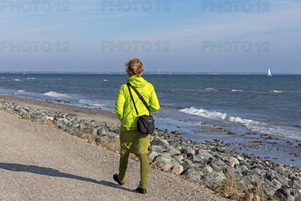 Stroller, path, Baltic Sea, sailing boat, Geltinger Birk nature reserve, Nieby, Schleswig-Holstein, Germany