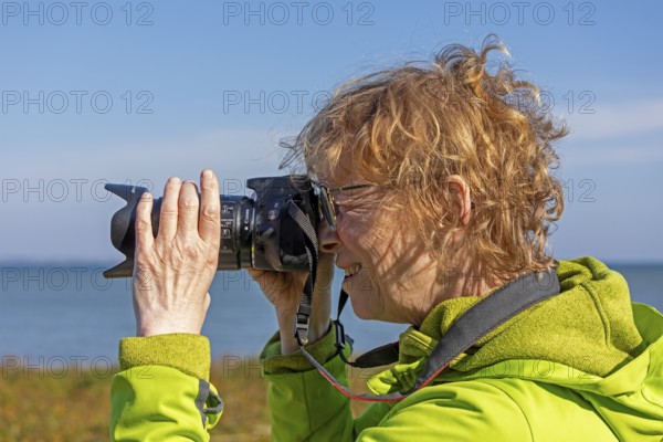 Elderly woman photographed, Baltic Sea, Geltinger Birk nature reserve, Nieby, Schleswig-Holstein, Germany