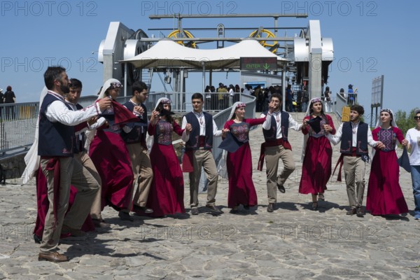 Group performing traditional dance in public, folklore, Tatev, Tatev, Syunik province, Syunik, Armenia