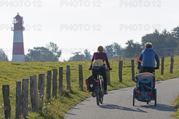 Lighthouse, cyclist, Falshöft, Pommerby, Schleswig-Holstein, Germany