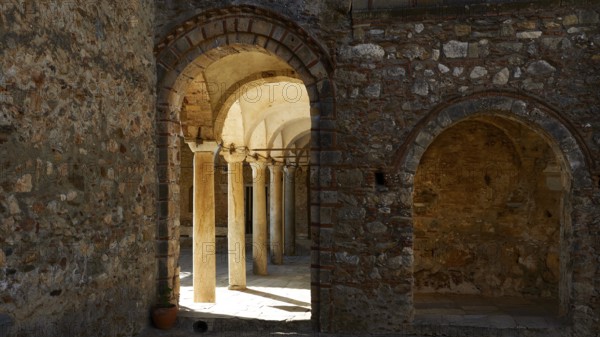 Metropolis, Metropolitan Church of Agios Dimitrios Mystras, A stone vault with arcades and columns, flooded with light and shadow, Mystras, Mistra, UNESCO World Heritage Site, Medieval Byzantine ruined city, north-west of Sparta, foothills of the Tyagetos Mountains, Peloponnese, peninsula, Greece