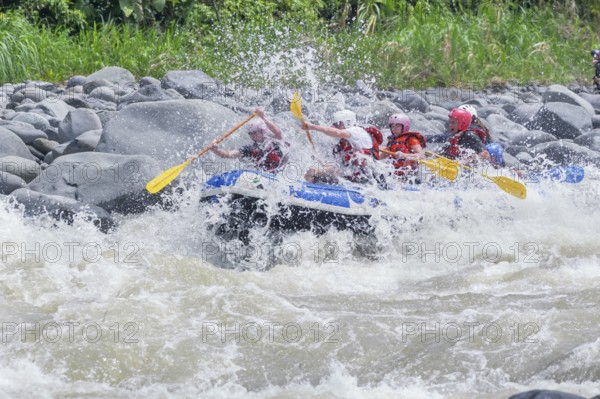 A group of people white water rafting, Costa Rica, Central America